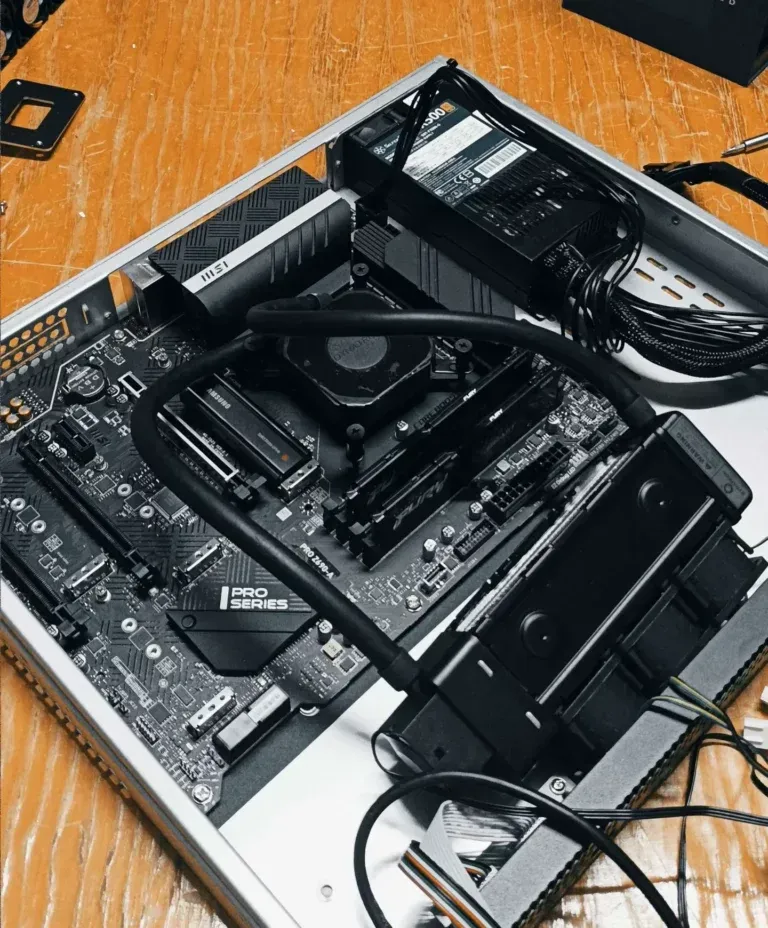 Liquid cooling loop mounted over the i9-13900K inside the open Rearmed server chassis