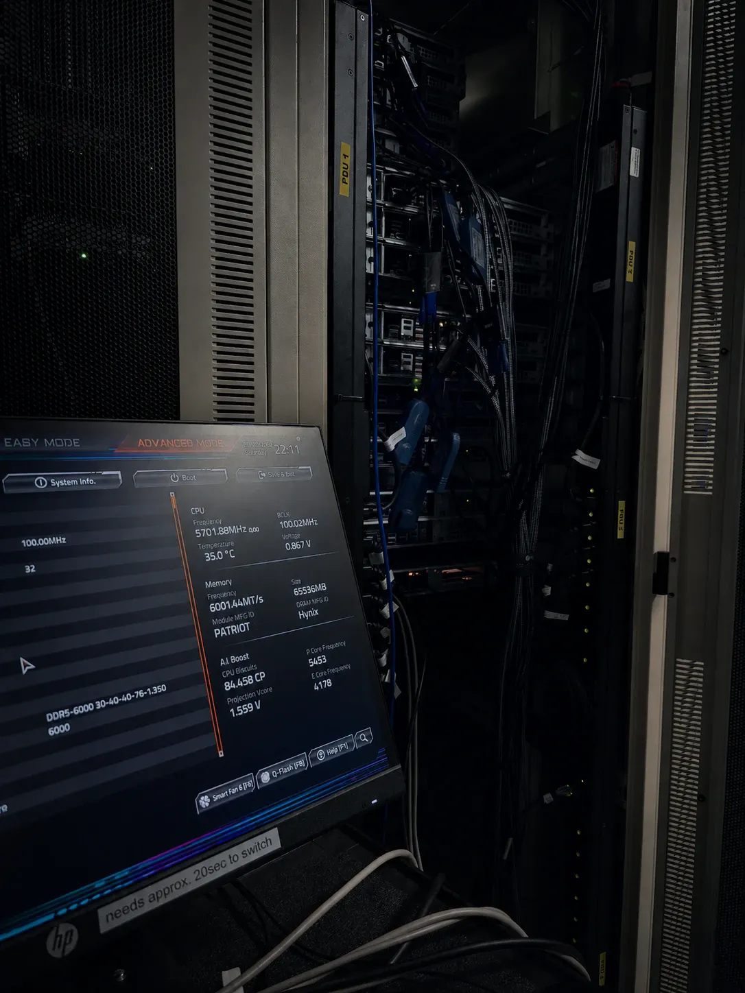 Open VYKIX rack servers beside a BIOS screen showing CPU and memory settings.